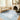 Handmade Turkish Oushak rug with soft wool, beige and blue floral design, traditional Oriental carpet on hardwood floor