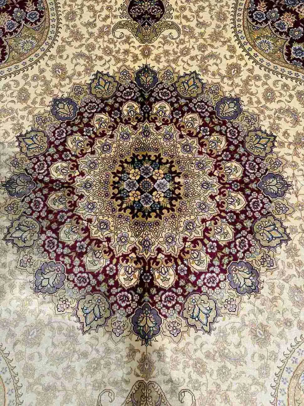 Detailed view of floral pattern on handmade silk oriental rug