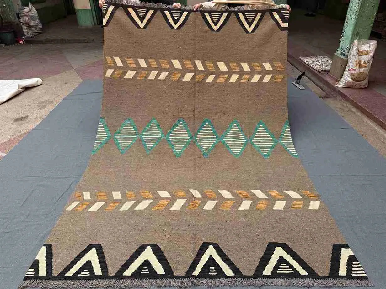 Top view of full 6x9 Kilim rug laid flat showing entire geometric design.