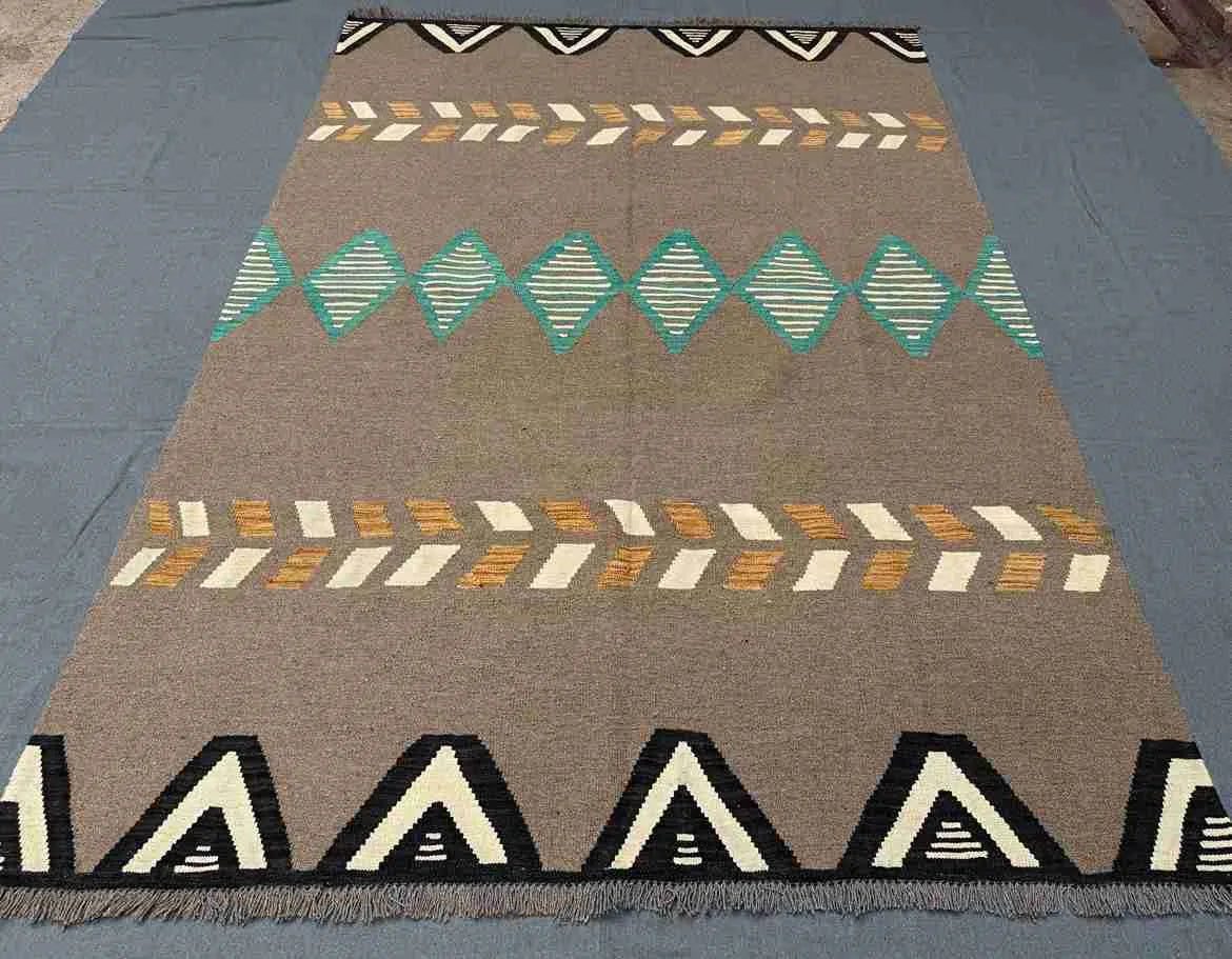 Brown and turquoise Kilim rug styled in hallway decor.
