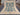 Full top view of handmade Turkish Oushak rug with pastel tribal patterns