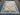 Full view of pastel floral Turkish Oushak rug on floor