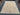Knotted hand-made wool rug with traditional design on floor