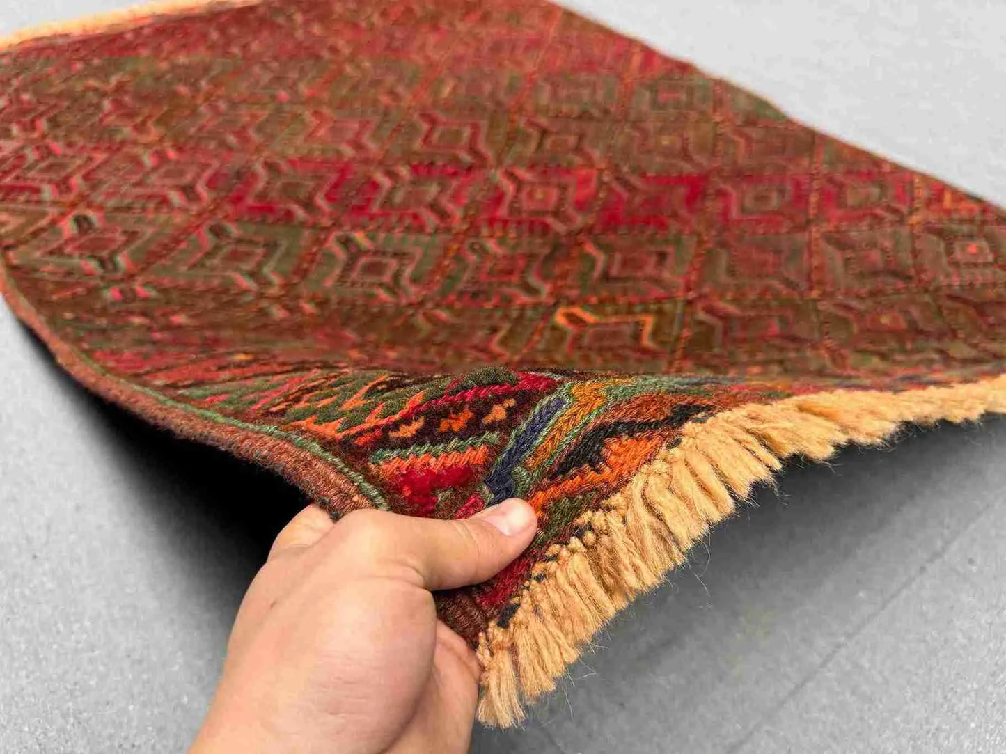 Handmade Afghan red kilim rug 3.5x4.9 ft shown in hands – tribal wool carpet