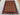 Afghan wool shawl rug laid out on floor – striped tribal area rug in boho setting.
