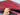 Authentic Afghan red wool rug in hand with visible knotted weave