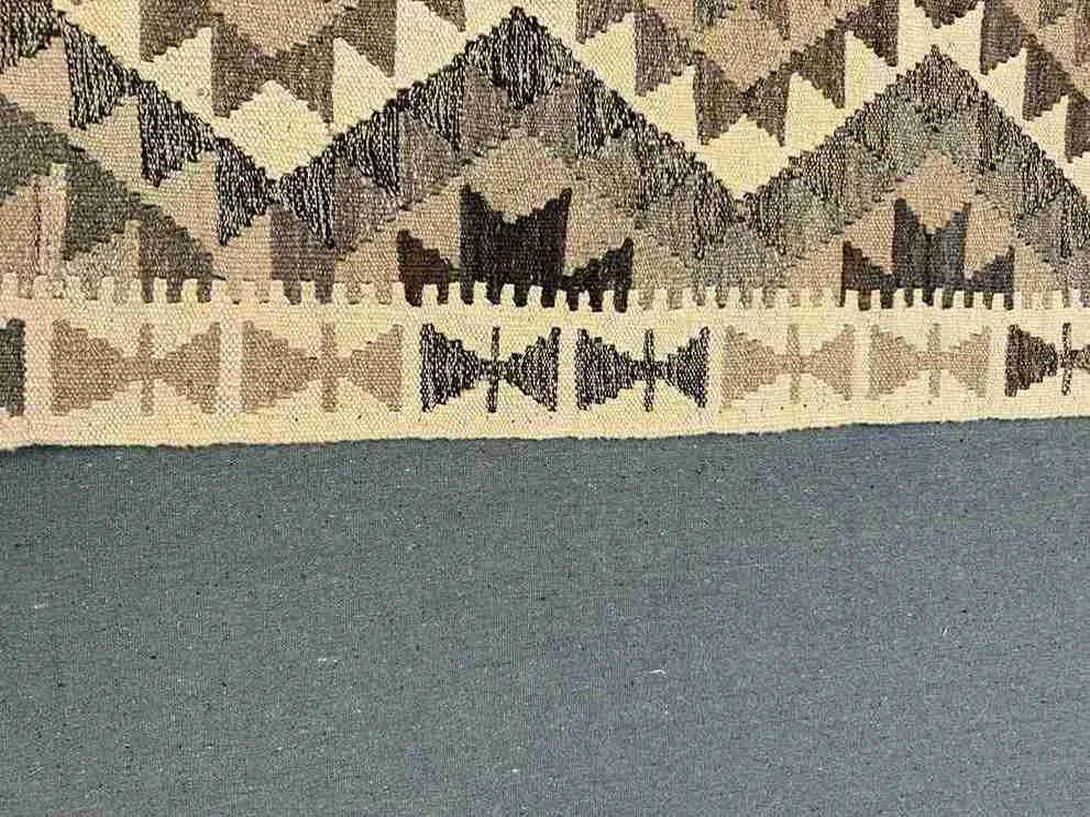 Authentic Turkish runner rug showing close-up of pattern and precise hand weaving.