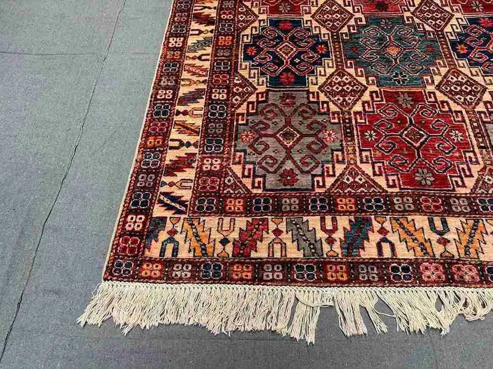 Corner view of authentic hand-knotted Waziri Oriental rug