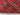 Folded backside of Turkish Kilim rug – hand-knotted wool carpet in red and black tribal pattern.