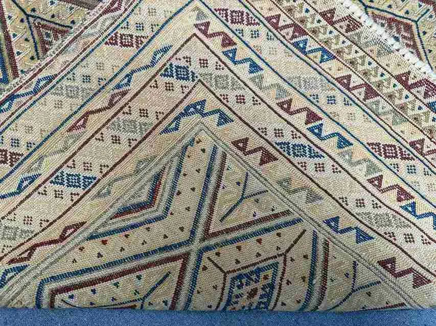 Backside view of handwoven kilim rug showing wool texture and craftsmanship