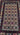 Close-up of vintage geometric motifs on Turkish Baluch rug