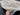 6x8 Blue Khotan Rug handheld view – front pattern details