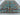 5x7 light blue and red oriental rug styled in interior