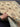 Authentic 6x8 handmade Chobi carpet shown in hands, beige and green wool