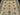 Close-up of beige and green floral pattern on Chobi wool rug