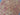 Close-up of geometric pattern on Afghan wool rug in red, black, and beige colors