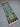 Flatweave tribal rug in teal and navy laid on wooden floor