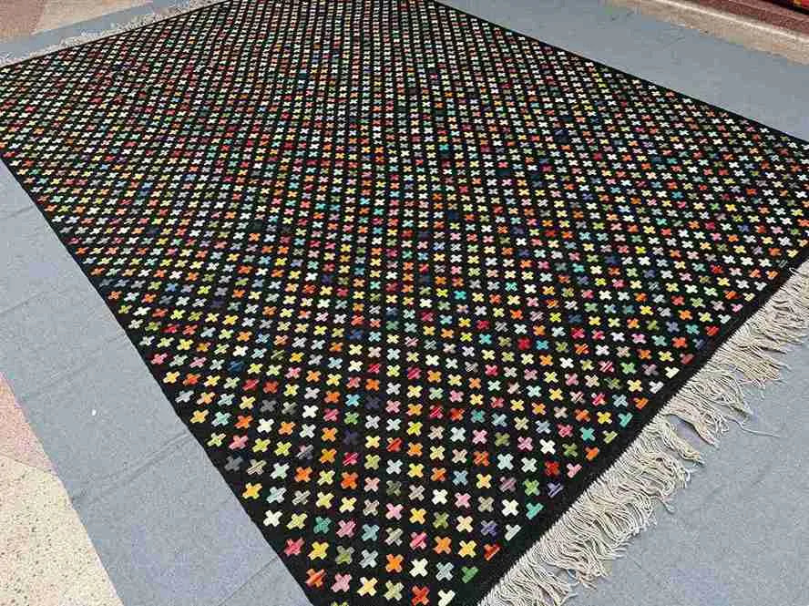 Colorful Turkish Kilim rug styled in boho-themed interior – modern wool flatweave.