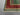 Corner detail of 6x8 red and teal Mamluk wool rug with geometric design