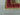 Corner detail of handmade 6x8 red and teal Mamluk rug