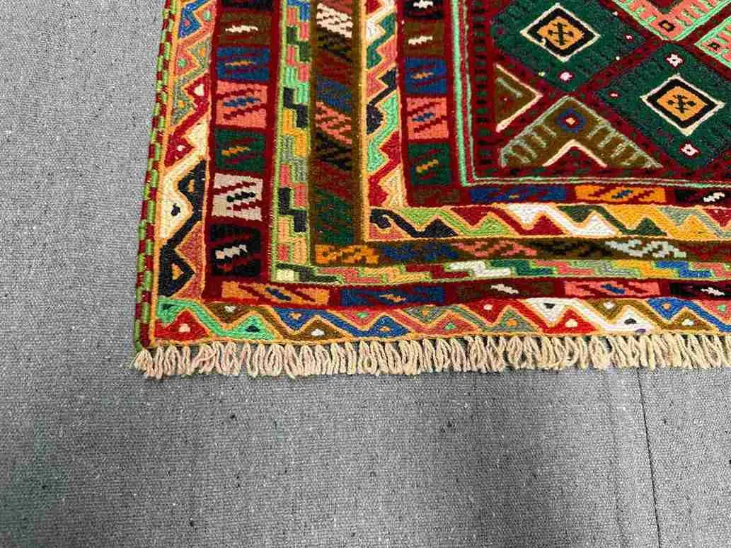 Corner detail of Persian Afghan kilim rug with multicolor tribal design