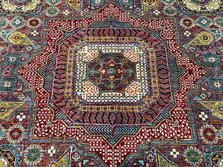 Close-up view of earthy toned modern Mamluk rug – intricate handmade pattern