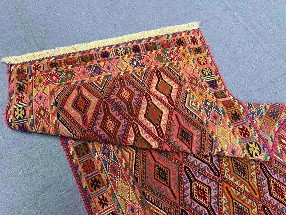 Folded Turkish kilim runner rug showing wool quality and color