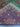 Folded view of multicolor handmade Oriental wool rug