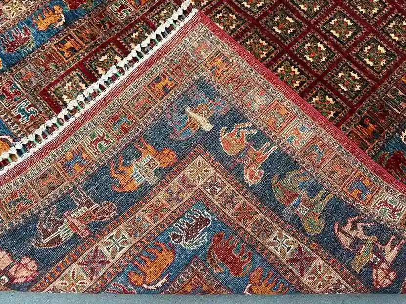 Folded view of authentic wool Pazyryk rug – showing handwoven texture