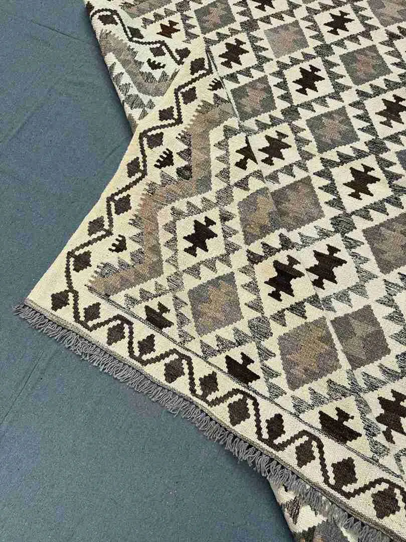 Folded view of Turkish Kilim rug – beige and brown handmade wool flatweave