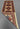 Side view of folded beige Turkish-Kazakh wool runner rug