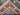 Folded view of handmade Turkish Blue & Red wool rug – Persian floral style.