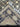 Folded view of black and beige handmade Oushak rug