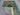 Folded view of handmade turquoise wool Mamluk rug – showing silk detail