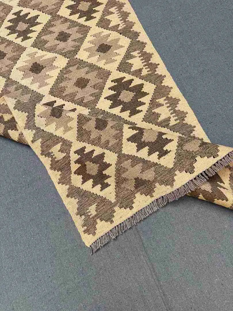 Layered folded display showing Kilim texture and pattern