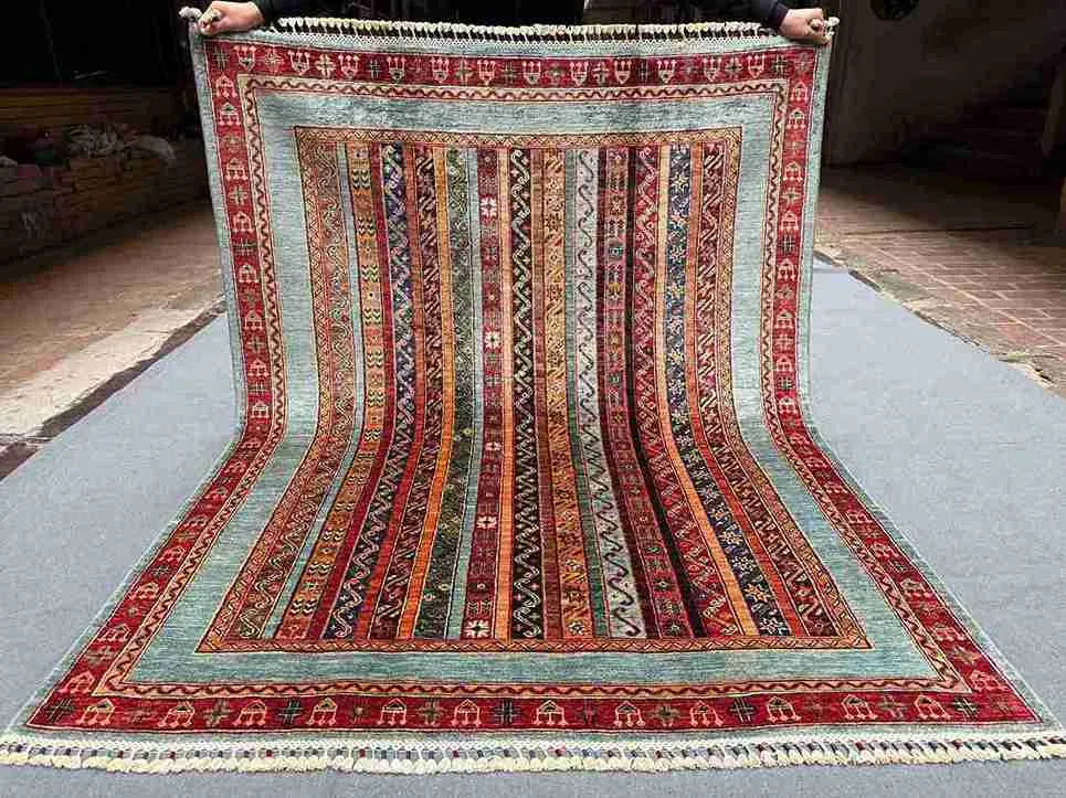 Full view of 5x6.6 floral striped Turkish kilim rug laid flat
