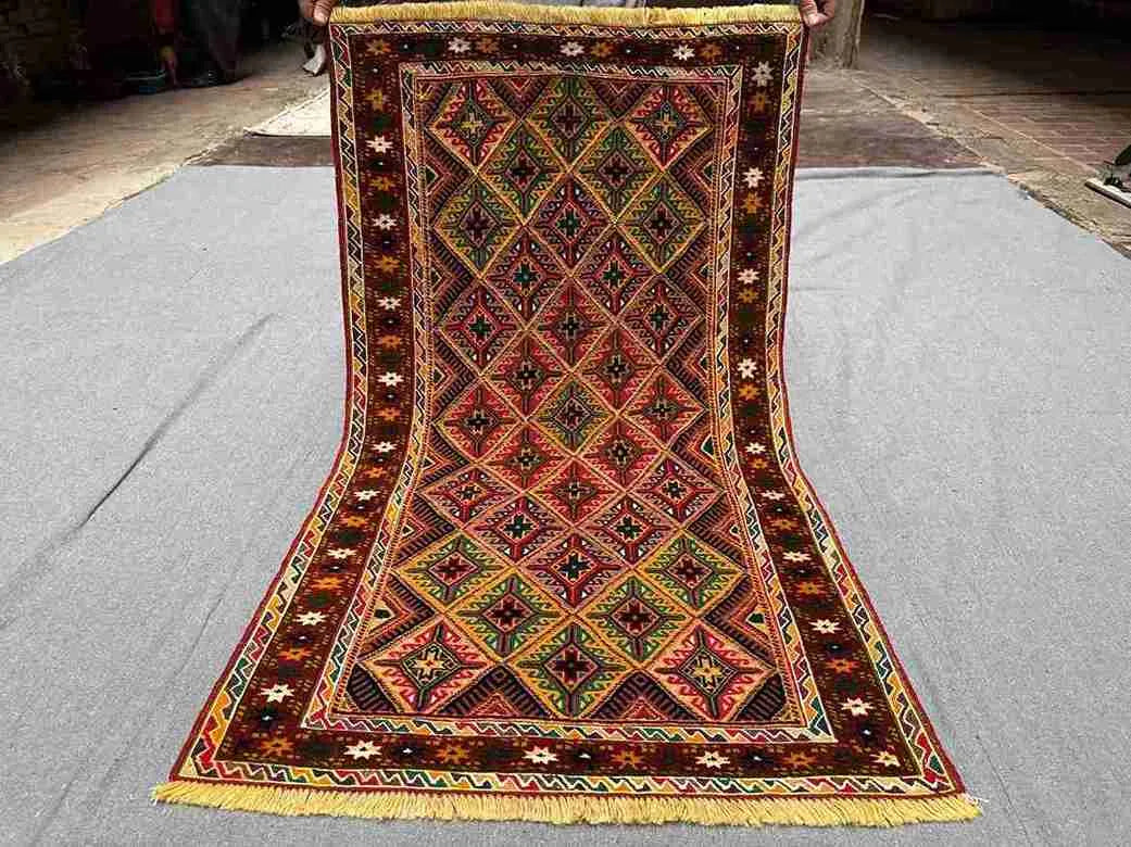 Full top view of handwoven 2.5x4.3 Turkish Afghan runner rug with red, green, and gold tribal geometric design
