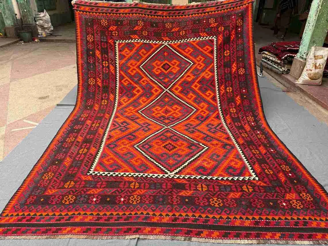 Full top-down view of handmade 8x12 Turkish Kilim rug – red and black geometric wool flatweave.
