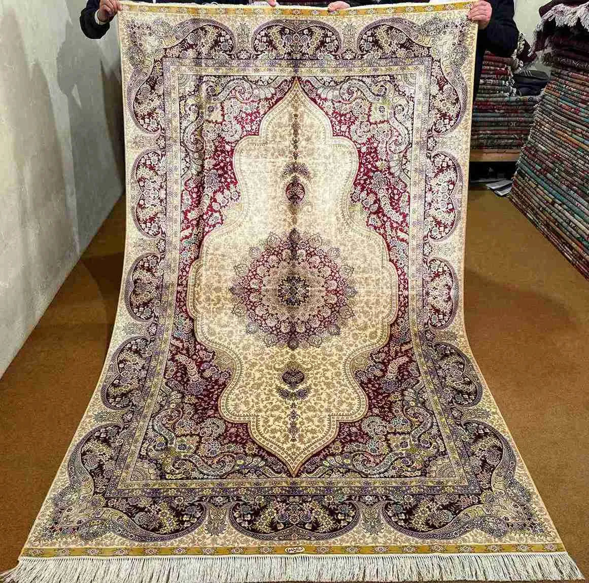 Full view of handmade 5x8 Persian-style silk oriental rug
