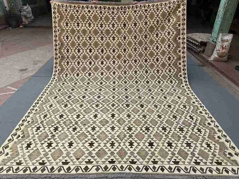 Full view of handmade Turkish Kilim rug – geometric wool flatweave in neutral earthy tones.