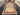 Full top-down view of authentic hand-knotted red and cream 5x7 wool rug