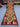 Full view of handmade Kilim runner rug in red and green tribal diamond pattern