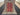 Full top-down view of authentic 5x7 red & beige Turkish Kazakh wool rug
