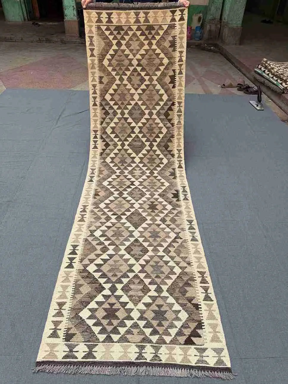 Full view of Turkish handmade Kilim runner rug – neutral tones with geometric design for hallway or rustic space.