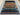 Large Persian Gabbeh rug laid on wooden floor for modern interior