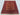 Geometric kilim rug on the floor showcasing tribal patterns