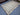 Floor-level angle view of gray Kilim wool area rug