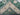 Knotted Green & Ivory Persian floral rug folded for display