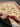 Handmade 5x7 red and cream wool carpet shown in hands – Chobi Persian floral design