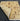 Display of Folded Beige and Brown Wool Area Rug